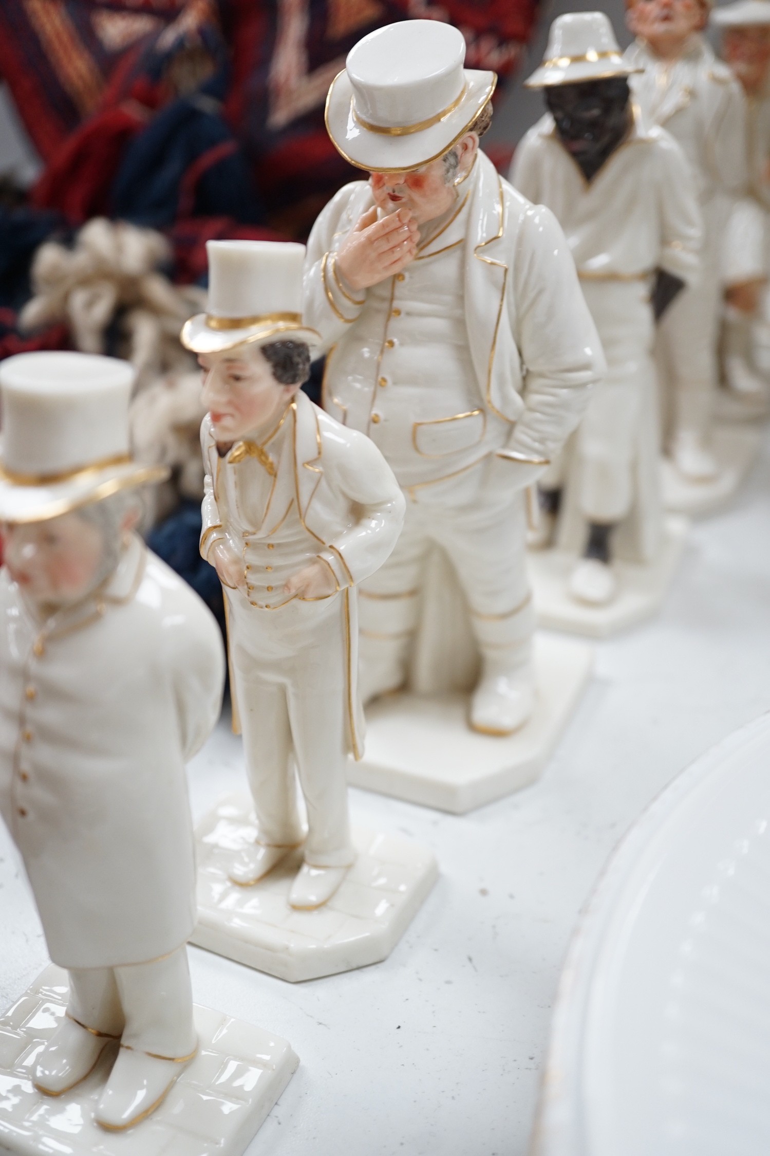 Seven Royal Worcester Hadleys figures of the World, tallest 17.5 cm